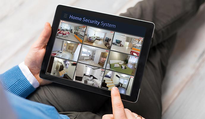 A person is monitoring different locations of his home