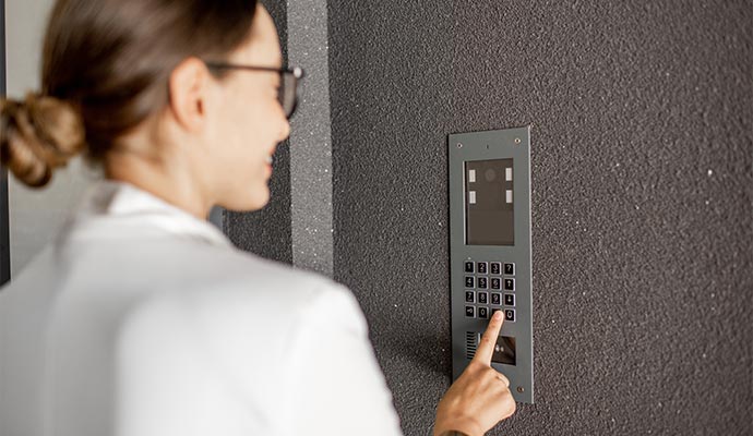 A person using intrusion alarm system