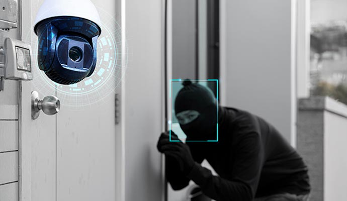 Security camera detecting burglary attempt at residential property