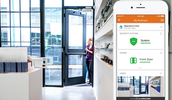 Business security system mobile app showing disarmed status and unlocked front door