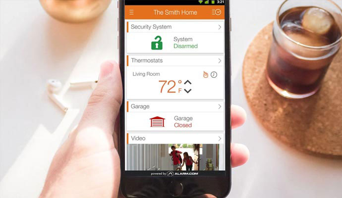 User watching home security features in mobile phone