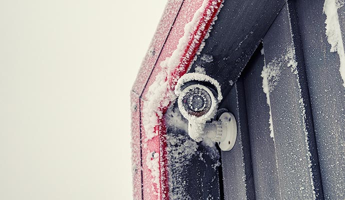 Home security camera covered with snow fall