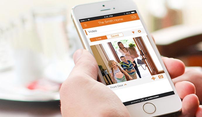 Person using home monitoring smart app 