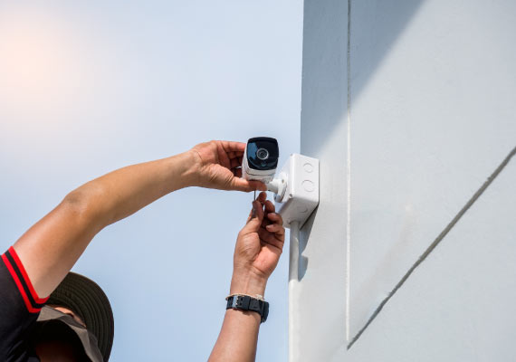 worker installed an outdoor bullet camera
