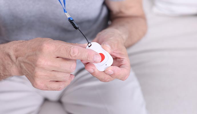 Person using wearable medical pendant device