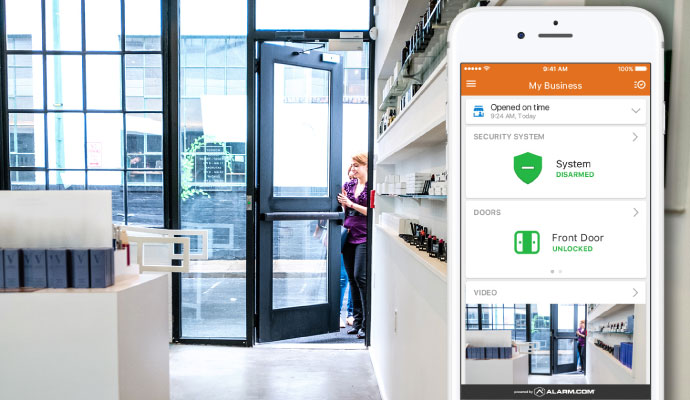 Smartphone app managing business security system door access and video monitoring inside commercial property