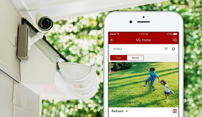Home security camera footage on smartphone showing live activity