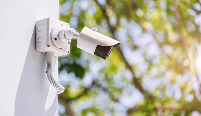 A security camera mounted on a modern property